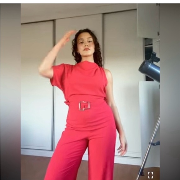 ASYMMETRIC CREPE BUCKLE JUMPSUIT
RED / CORAL . SIZE M, L - Picture 5 of 16